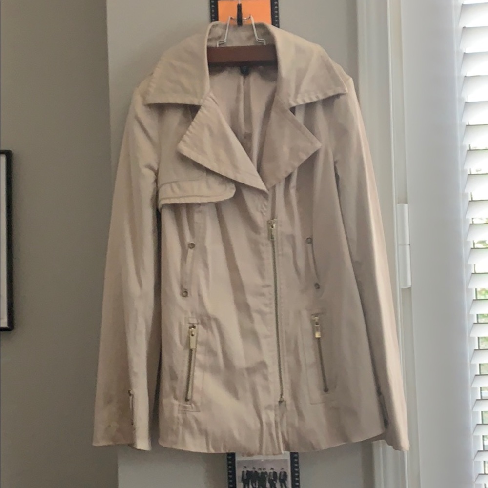 Bebe , lightly worn, gold tan in color